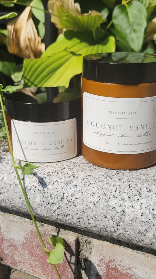 Whipped shea butter in jar with creamy coconut vanilla texture, set against clean neutral background